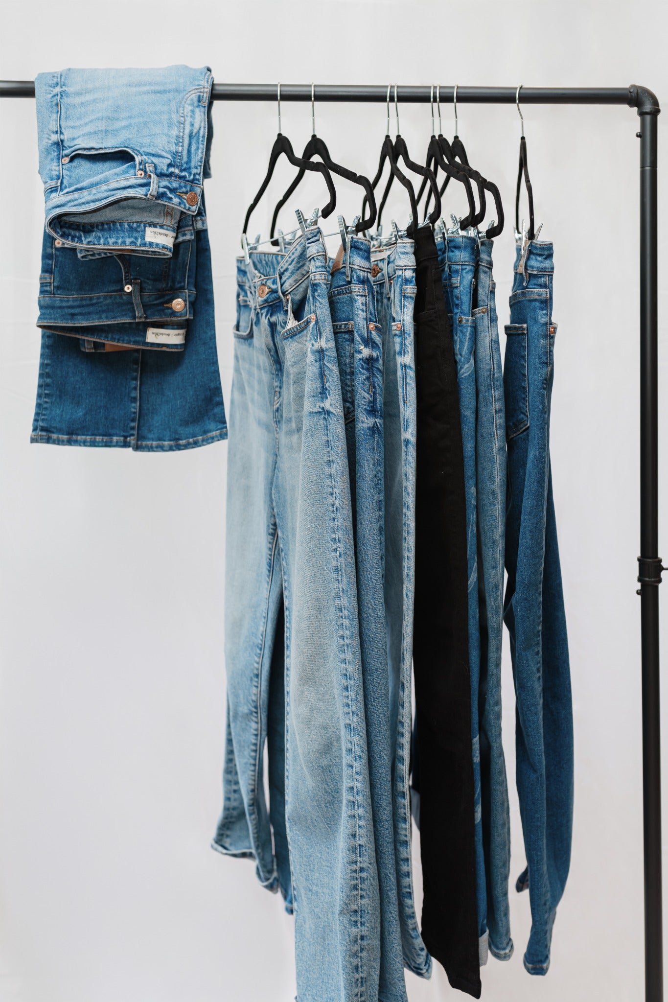 Ginger and Dandelion jeans hanging together on a clothing rack